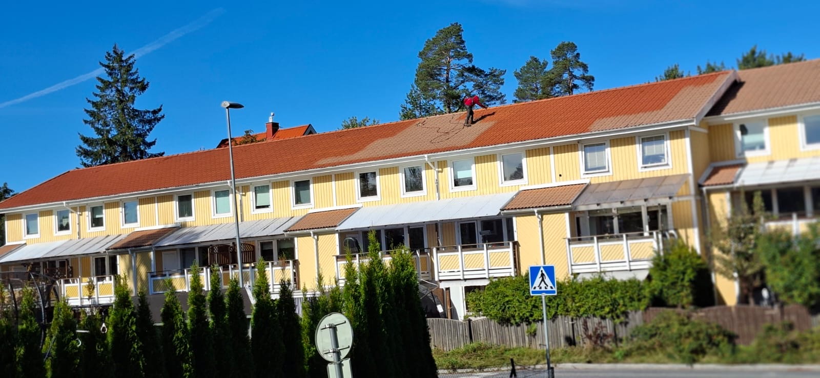 red wooden door on white wall